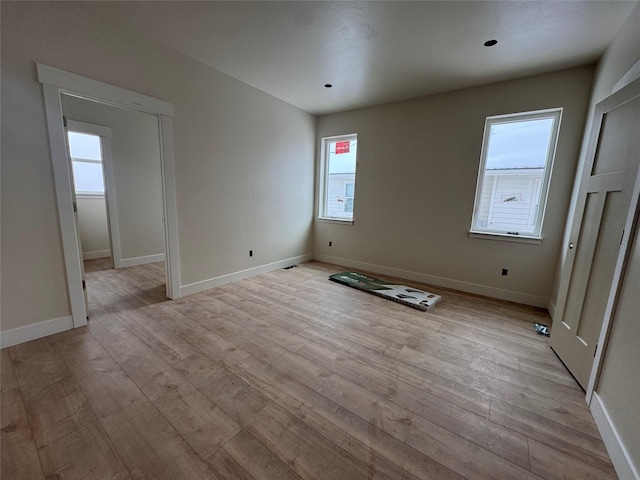 spare room with light hardwood / wood-style floors