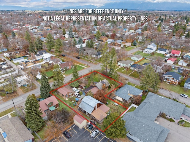 1312 2nd Ave E, Kalispell, MT 59901 - aerial perspective of suburban area with property boundaries highlighted