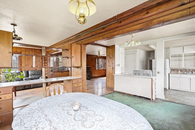 1312 2nd Ave E, Kalispell, MT 59901 - dining space with wood walls and a chandelier