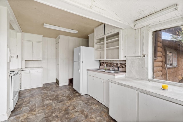 1312 2nd Ave E, Kalispell, MT 59901 - kitchen with white appliances, white cabinetry, stone finish floors, and light countertops