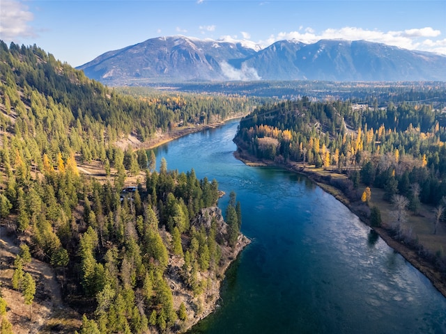 bird's eye view with a water and mountain view