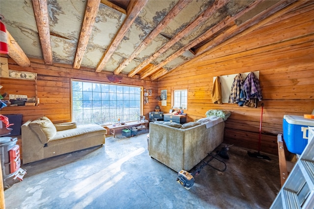 living room with wood walls, concrete flooring, and vaulted ceiling