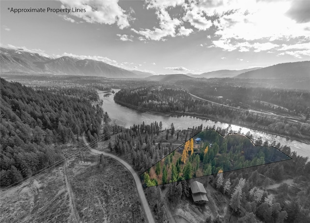 bird's eye view with a water and mountain view