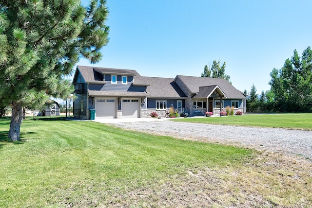 view of front of property with a garage and a front yard