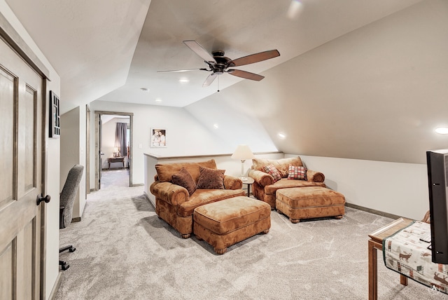 interior space featuring light colored carpet, lofted ceiling, and ceiling fan