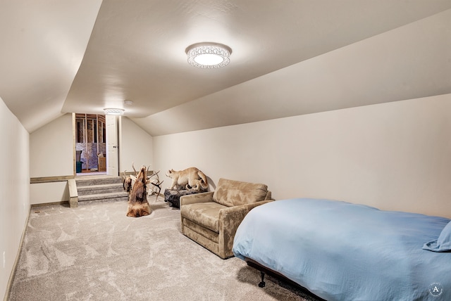 carpeted bedroom featuring lofted ceiling