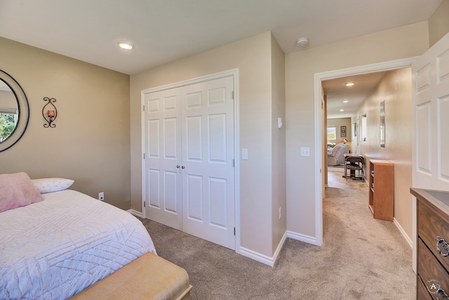 carpeted bedroom with a closet