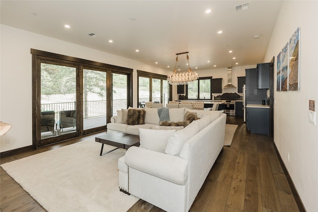3868 Gelande St Unit 4, Whitefish, MT 59937 - living room featuring dark wood-style floors, visible vents, recessed lighting, and an inviting chandelier