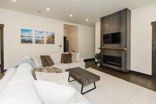 3868 Gelande St Unit 4, Whitefish, MT 59937 - living area with visible vents, baseboards, a fireplace, wood finished floors, and recessed lighting