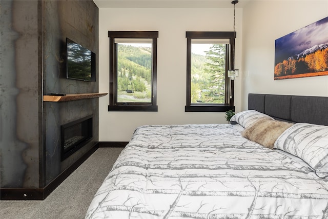 3868 Gelande St Unit 4, Whitefish, MT 59937 - carpeted bedroom with baseboards and a fireplace