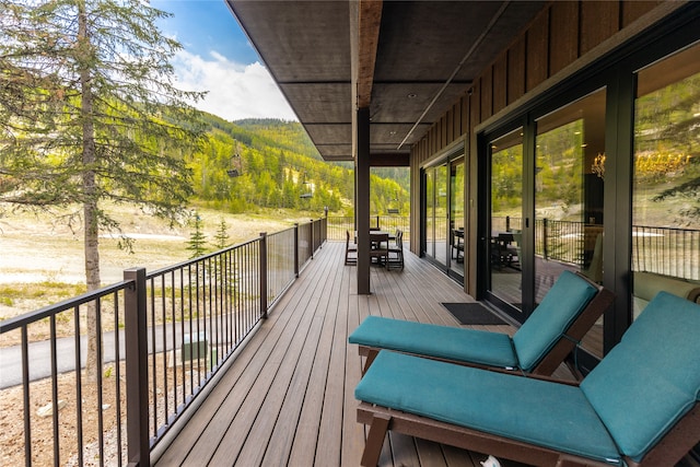 3868 Gelande St Unit 4, Whitefish, MT 59937 - wooden terrace featuring outdoor dining area