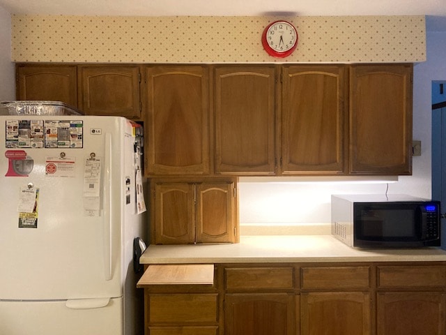 kitchen featuring white refrigerator