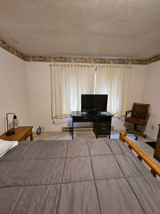 bedroom with a textured ceiling and carpet