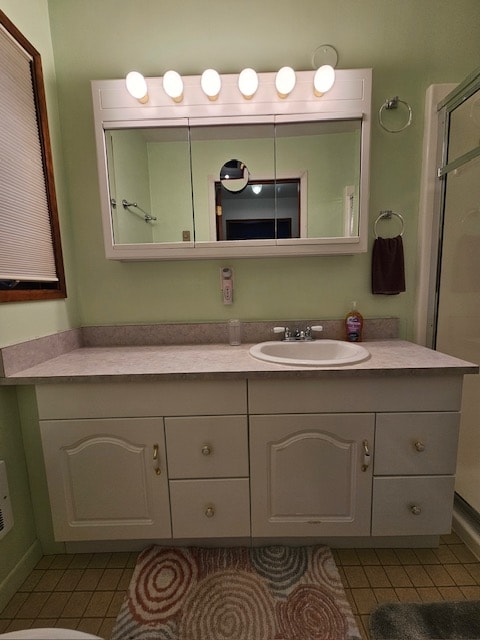 bathroom with vanity and tile patterned floors