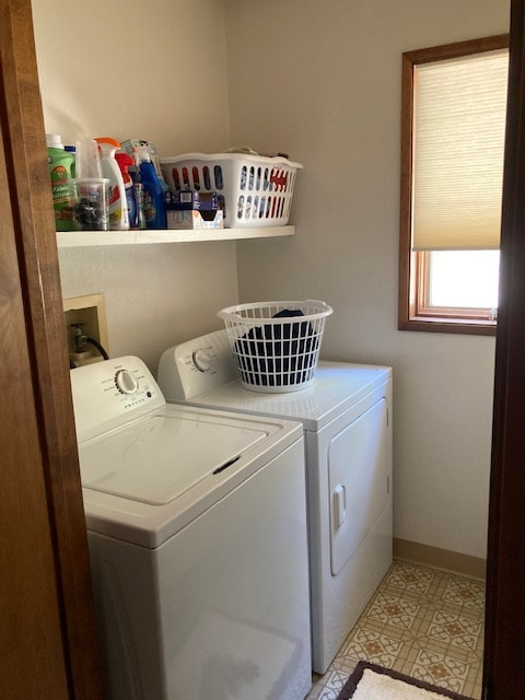 washroom with washer and dryer