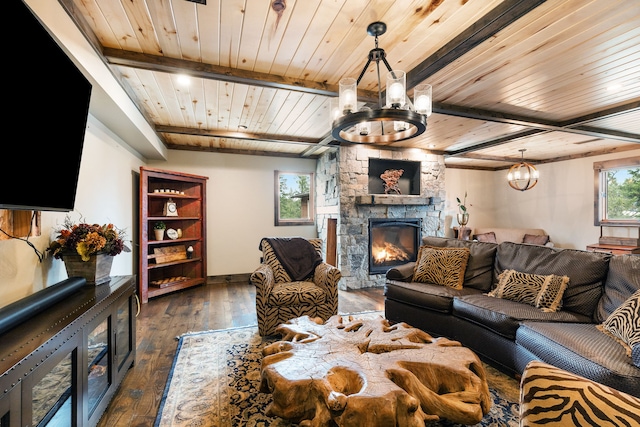 16485 Folsom Rd, Florence, MT 59833 - living area featuring a chandelier, wooden ceiling, beamed ceiling, dark wood-style floors, and a stone fireplace