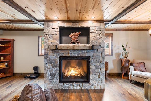 16485 Folsom Rd, Florence, MT 59833 - living room with wood ceiling, baseboards, hardwood / wood-style flooring, a fireplace, and beamed ceiling
