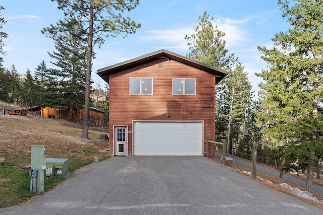 16485 Folsom Rd, Florence, MT 59833 - view of home's exterior with driveway and an attached garage