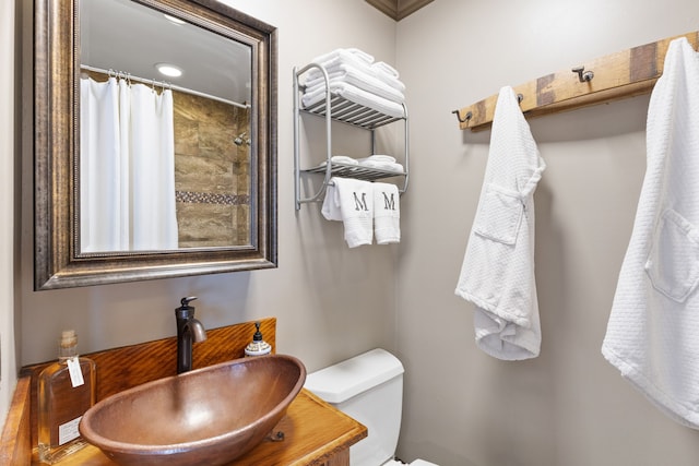 16485 Folsom Rd, Florence, MT 59833 - full bathroom with toilet, a shower with curtain, and vanity