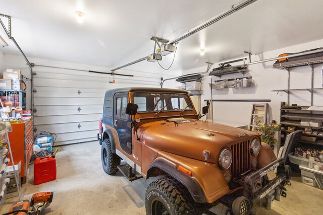 16485 Folsom Rd, Florence, MT 59833 - garage featuring a garage door opener