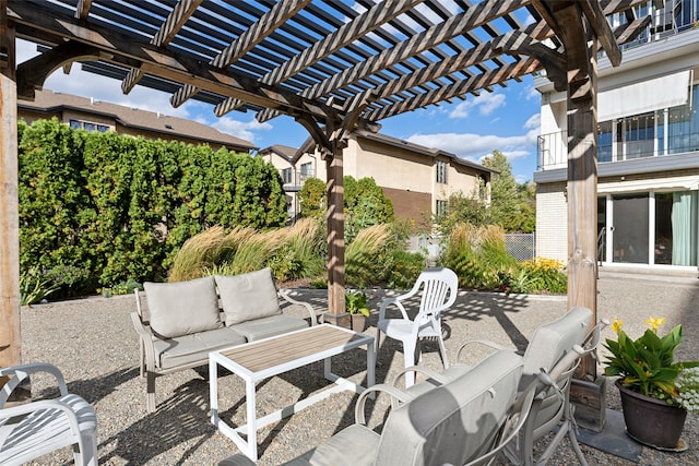 view of patio featuring an outdoor hangout area and a pergola