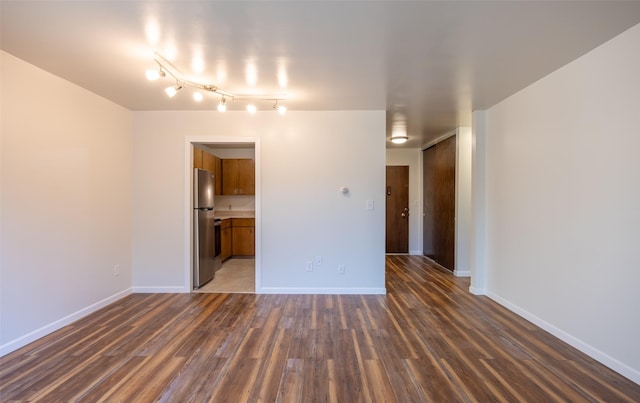 spare room featuring dark hardwood / wood-style floors