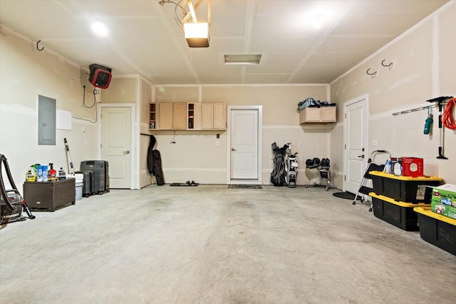 garage featuring a garage door opener and electric panel