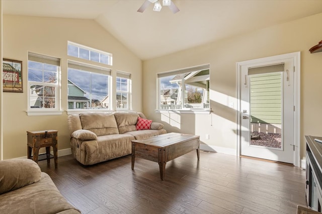 living room with ceiling fan, dark hardwood / wood-style floors, and high vaulted ceiling