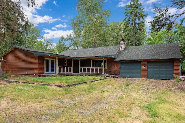 view of front facade with a garage and covered porch