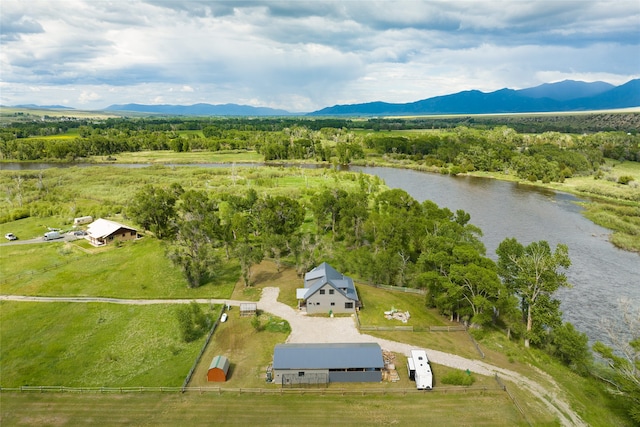 bird's eye view with a water and mountain view