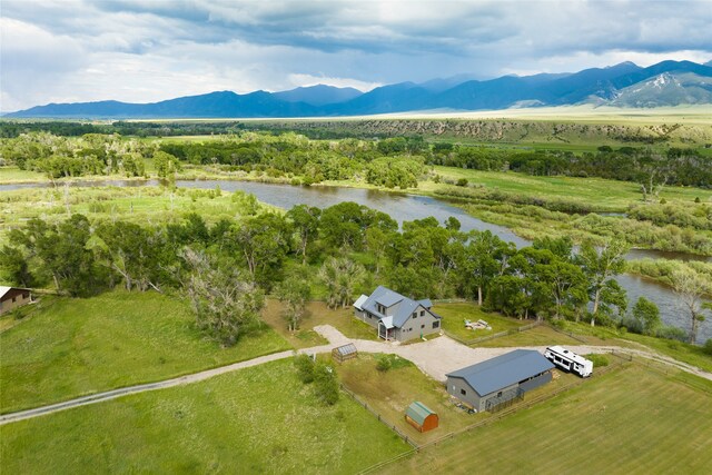 aerial view with a water and mountain view and a rural view