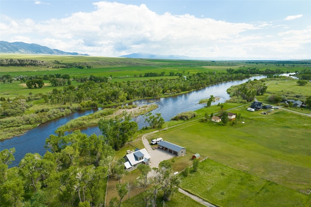 birds eye view of property with a water and mountain view and a rural view