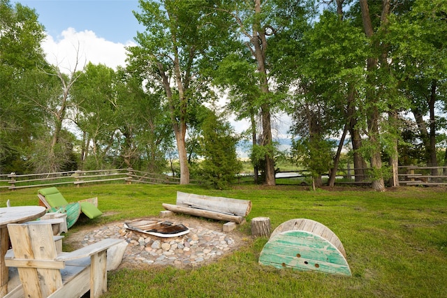 view of yard with an outdoor fire pit