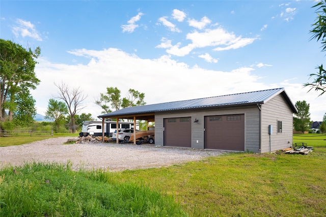 garage with a lawn