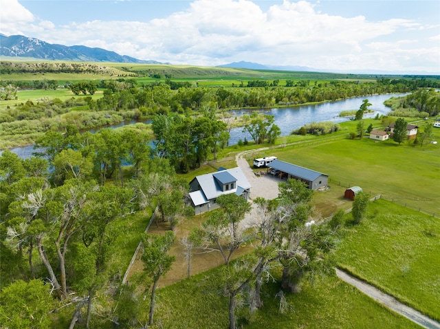 bird's eye view with a water and mountain view and a rural view