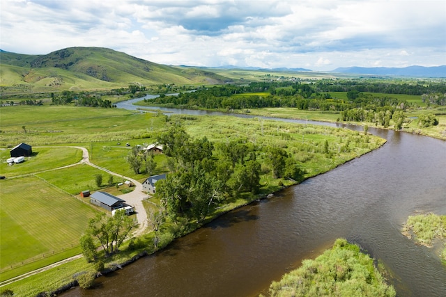 bird's eye view with a water and mountain view and a rural view