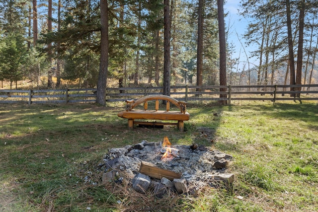 view of yard with an outdoor fire pit