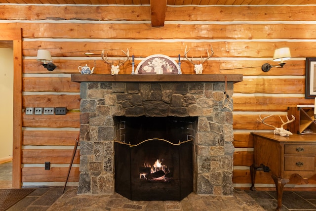 details with a fireplace, wooden ceiling, and beam ceiling