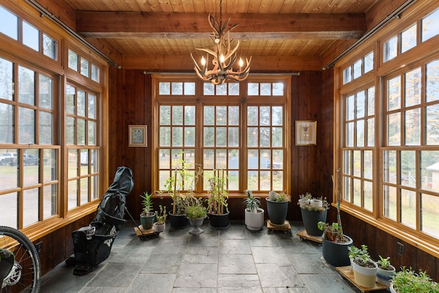 sunroom / solarium with wooden ceiling, beamed ceiling, and a notable chandelier