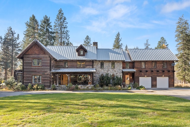 view of front facade featuring a front yard and a garage