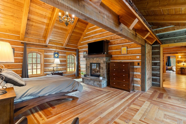 bedroom featuring a fireplace, lofted ceiling with beams, wood ceiling, and light hardwood / wood-style floors