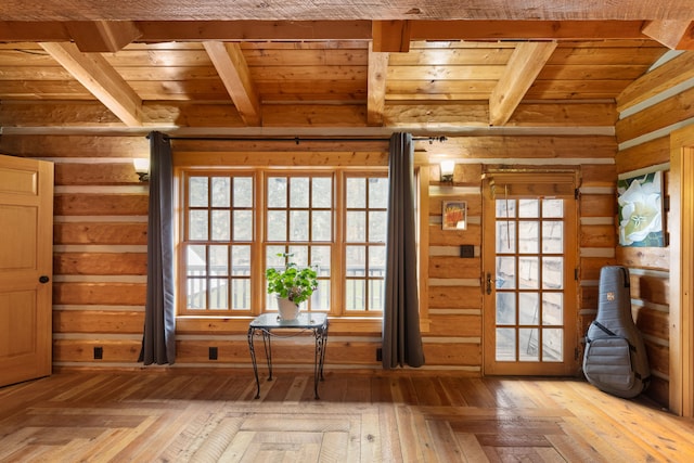 entryway with vaulted ceiling with beams, light hardwood / wood-style flooring, and wooden ceiling