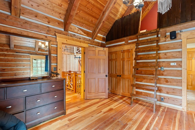 unfurnished bedroom featuring wooden ceiling, wood walls, beam ceiling, and light hardwood / wood-style floors