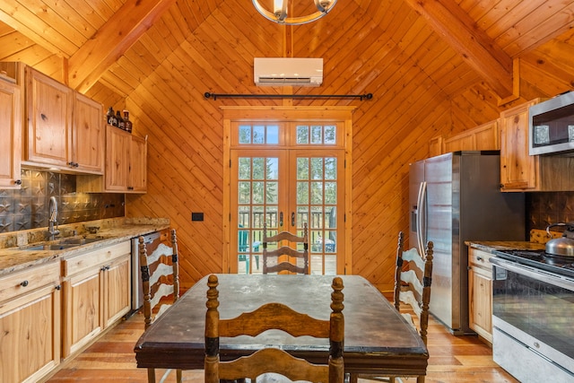 kitchen with wood walls, light hardwood / wood-style flooring, and beamed ceiling