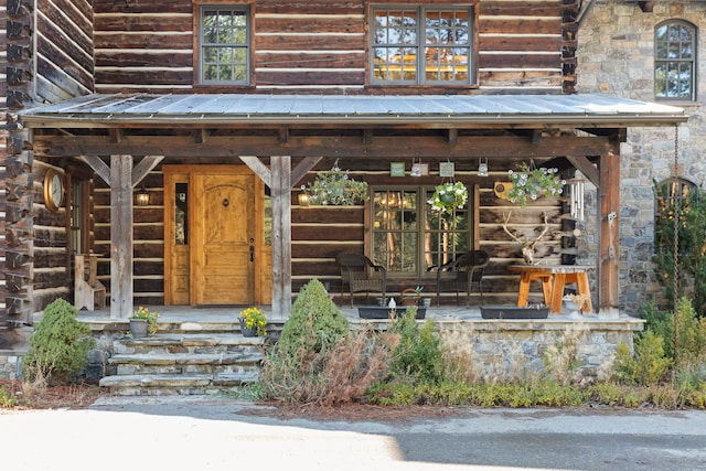 property entrance featuring covered porch