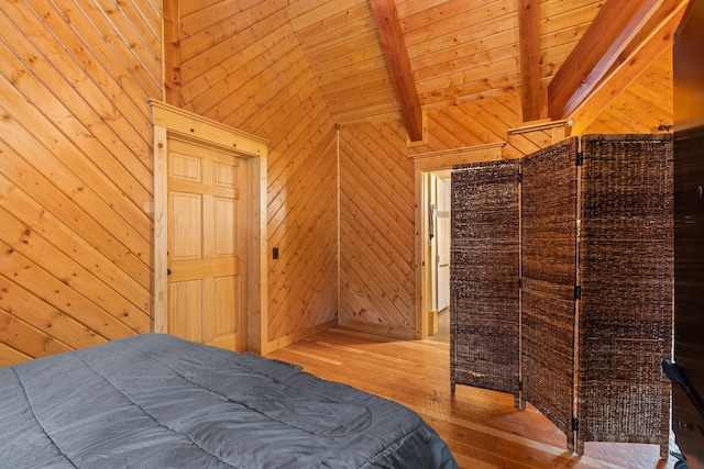 bedroom with beam ceiling, wooden ceiling, high vaulted ceiling, wood walls, and light hardwood / wood-style floors