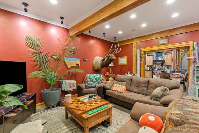 living room featuring beamed ceiling and ornamental molding