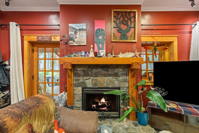 living room with a fireplace and ornamental molding