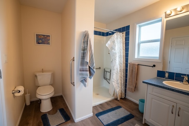 bathroom with hardwood / wood-style floors, vanity, and a shower with shower curtain