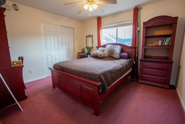 carpeted bedroom with a closet and ceiling fan